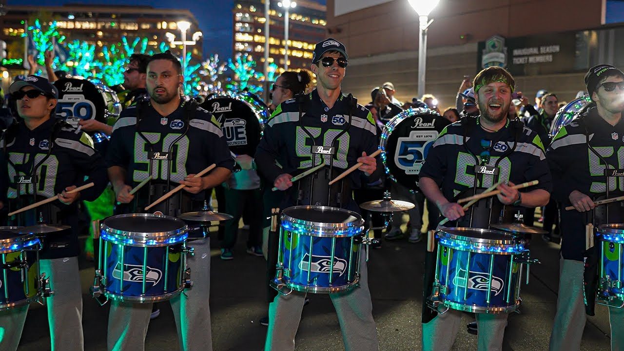 Seahawks Blue Thunder snare line performing outside the stadium at night